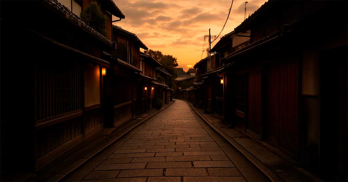 anthony-bourdain-tribute-lonely-japanese-street A quiet cobblestone street in a traditional Japanese neighborhood at sunset, evoking solitude, reflection, and the spirit of travel.